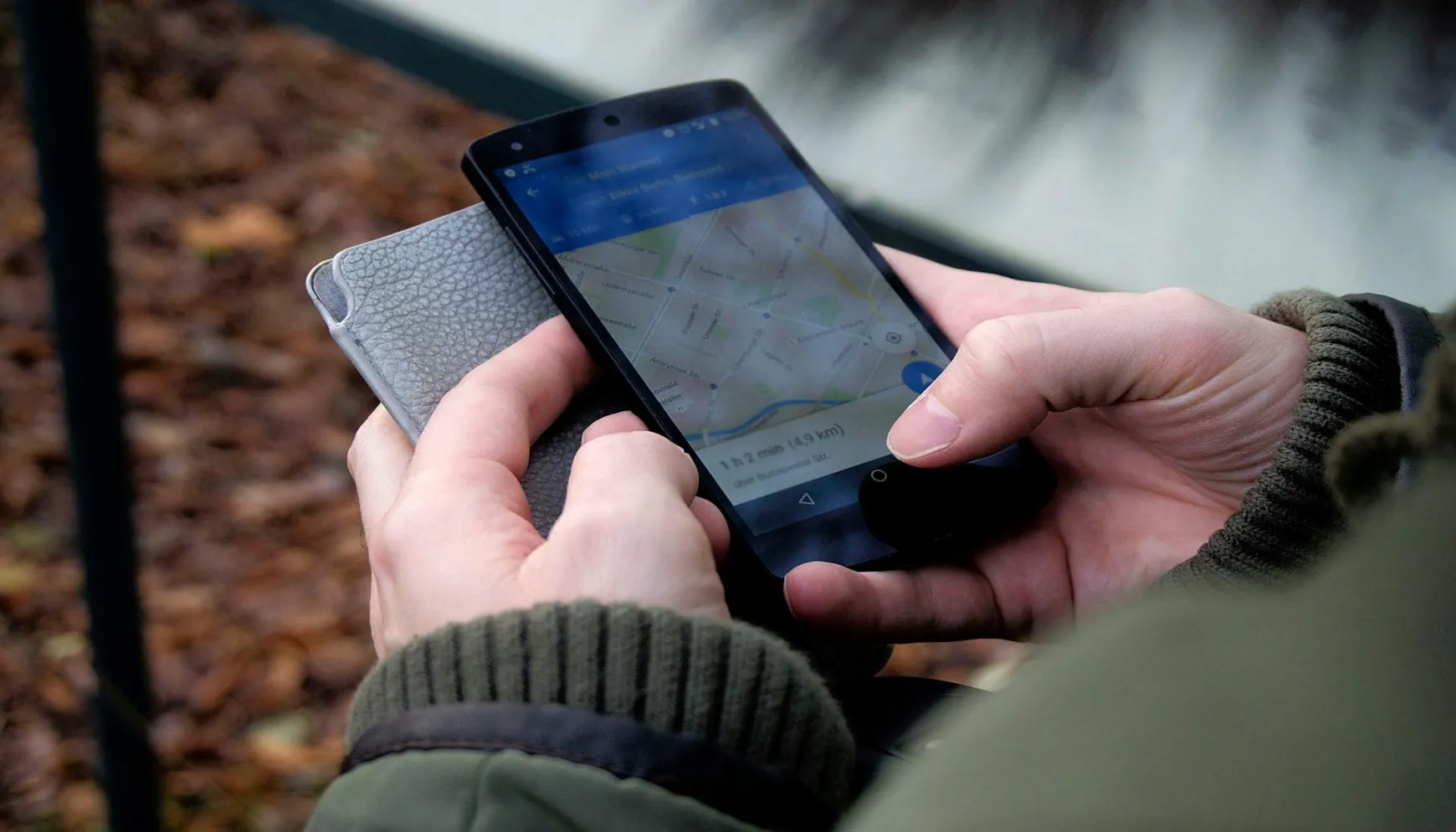 Person using Google Maps application on a smartphone to search for local businesses.